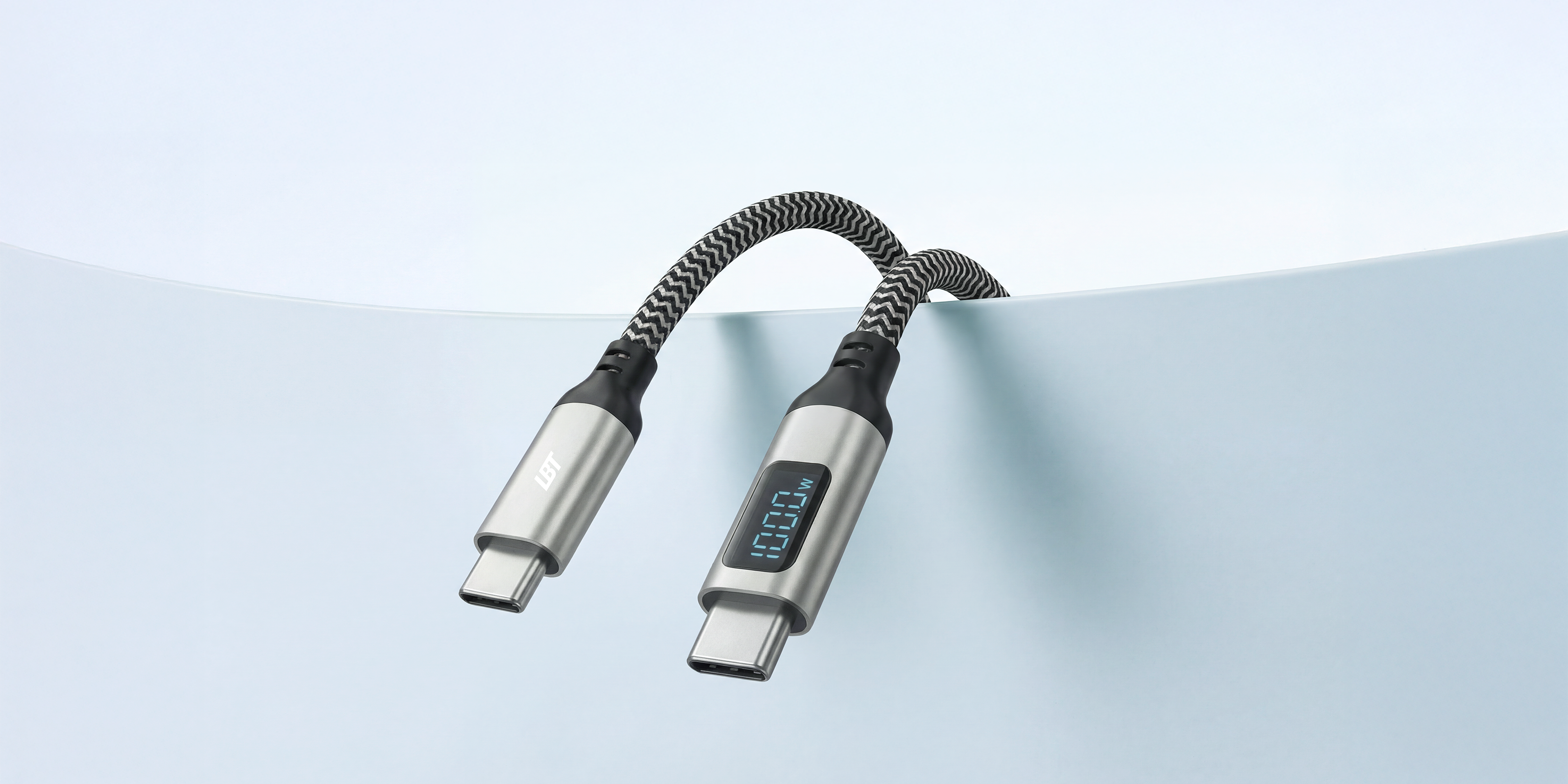 Two USB-C cables with digital displays on a light blue background