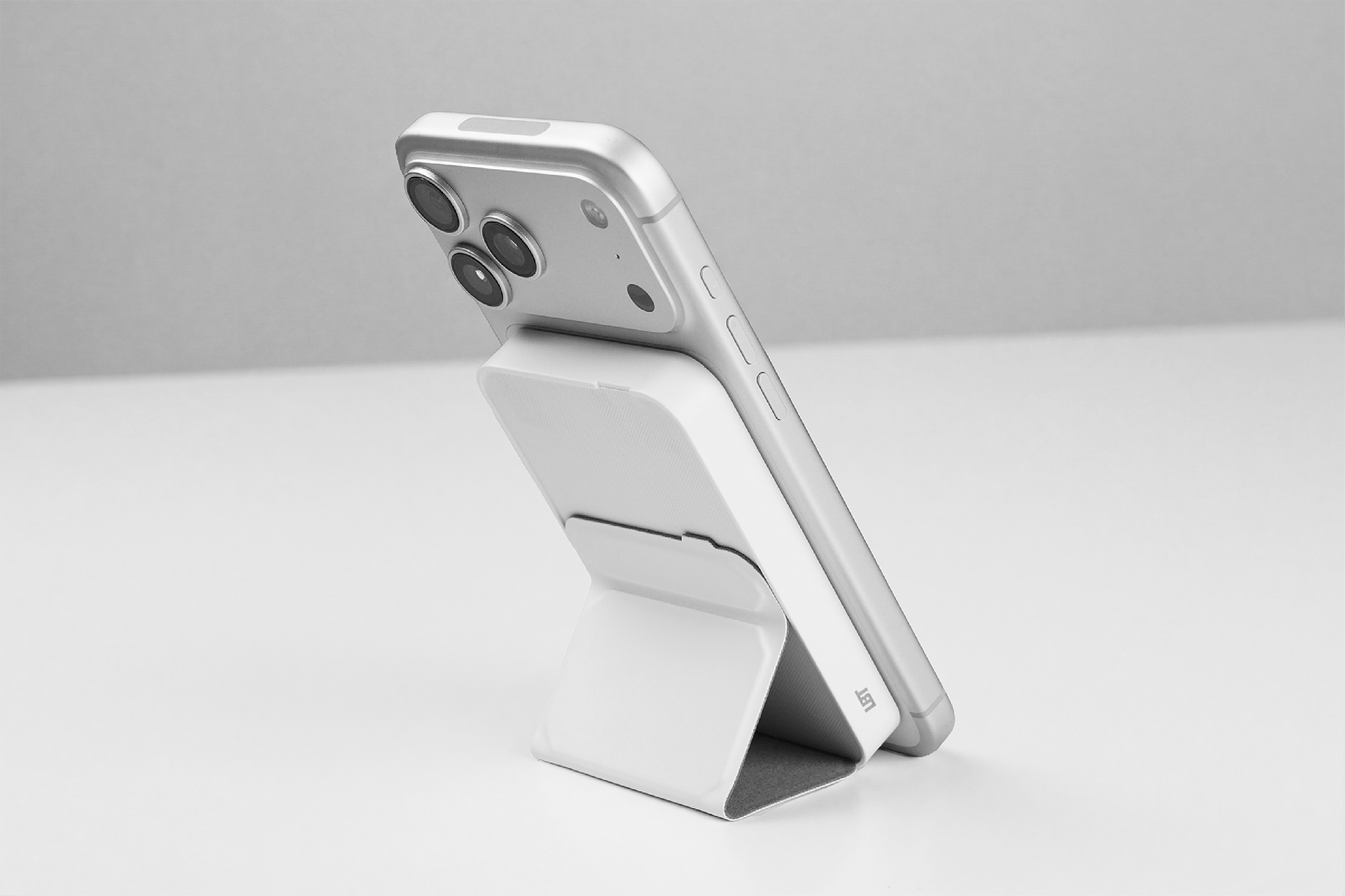 Smartphone with a power bank stand on a light gray background