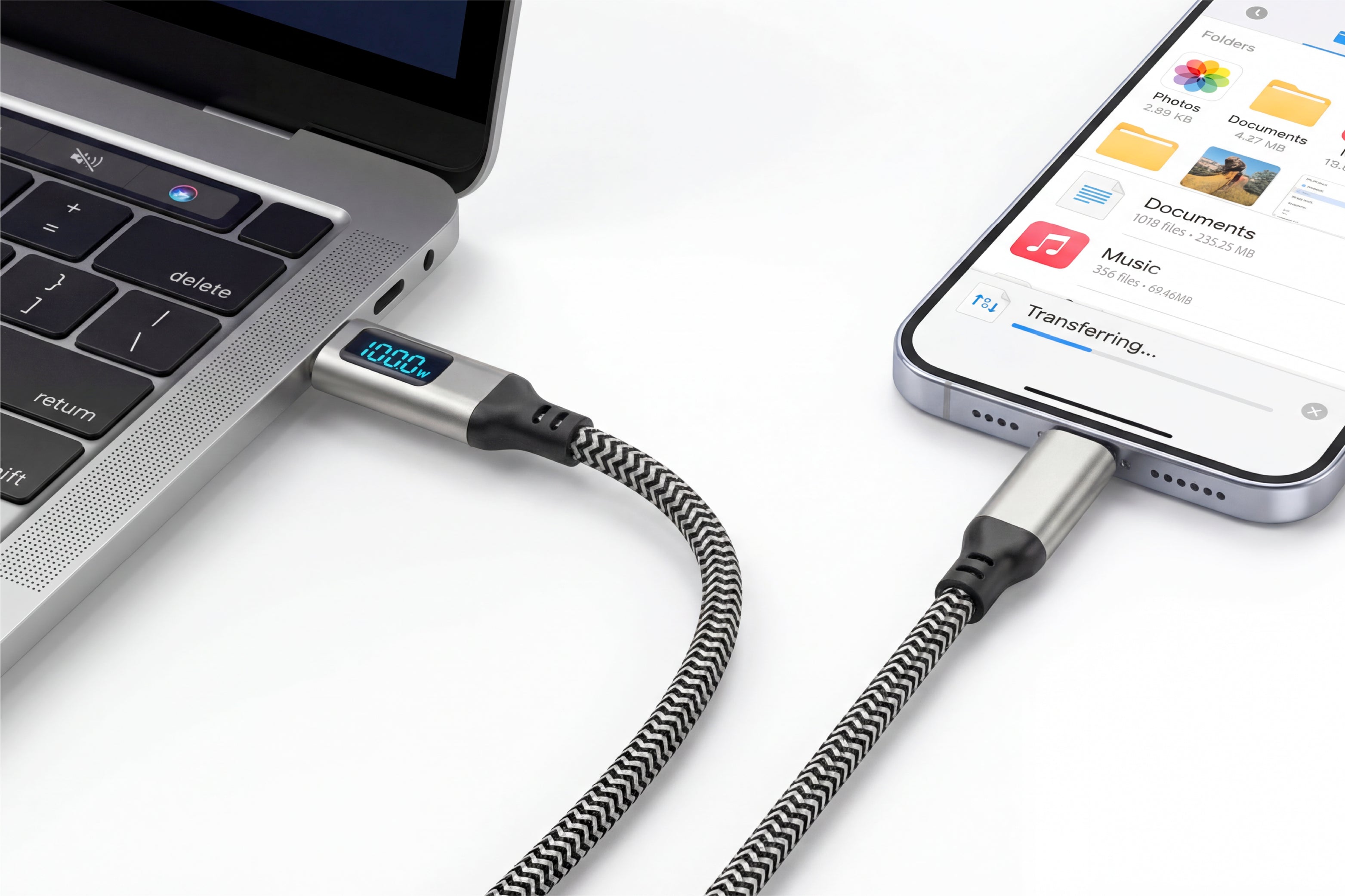 Laptop and smartphone connected by a braided cable on a white background