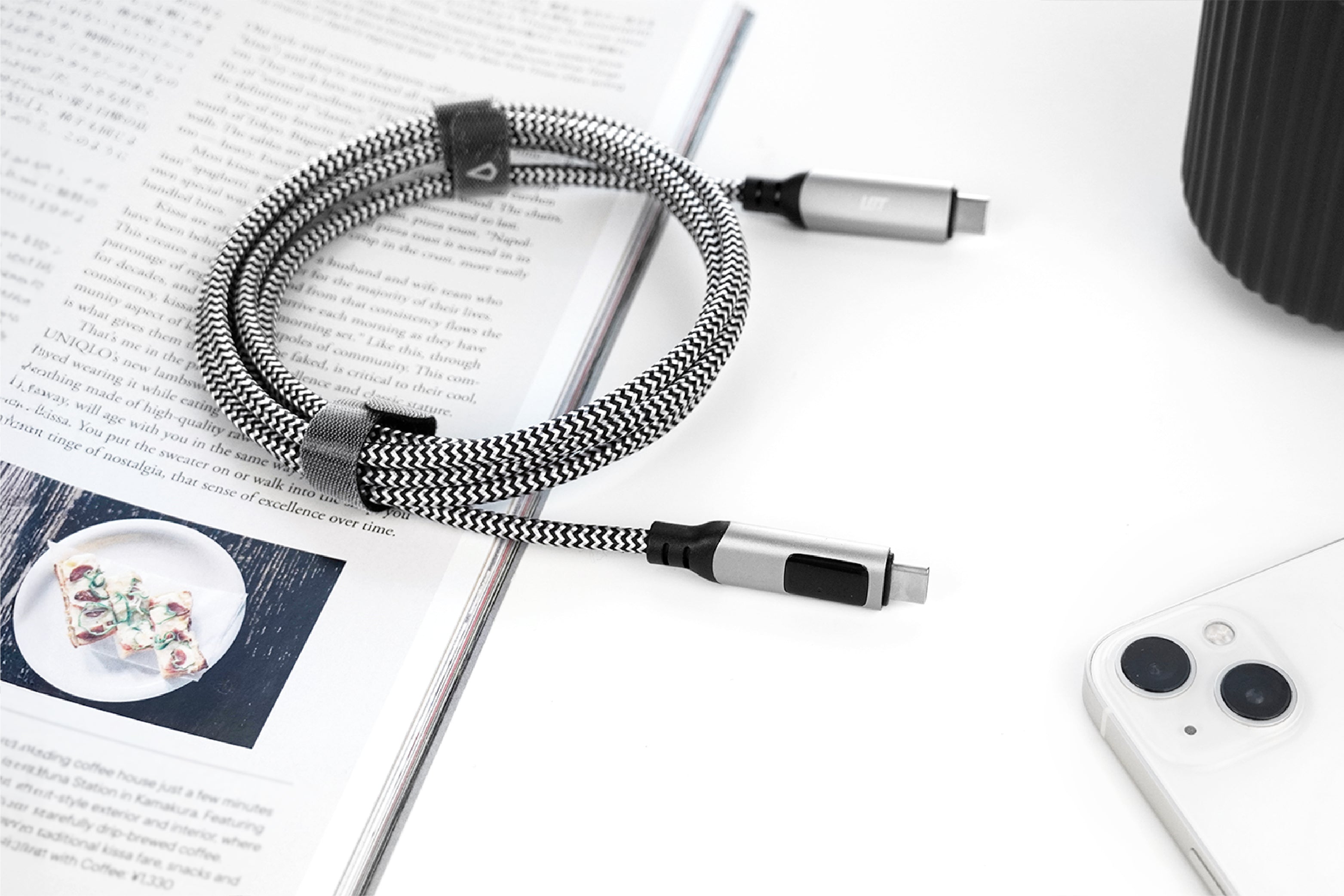 Braided cable with USB connectors on a magazine and phone